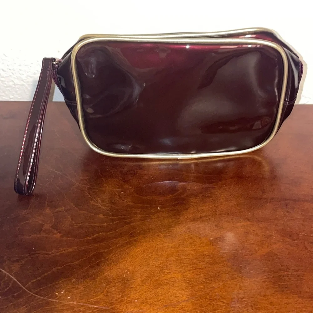 Avon Irridescent Burgundy PVC Make Up Bag Wristlet Gold Trim 2003 NOS